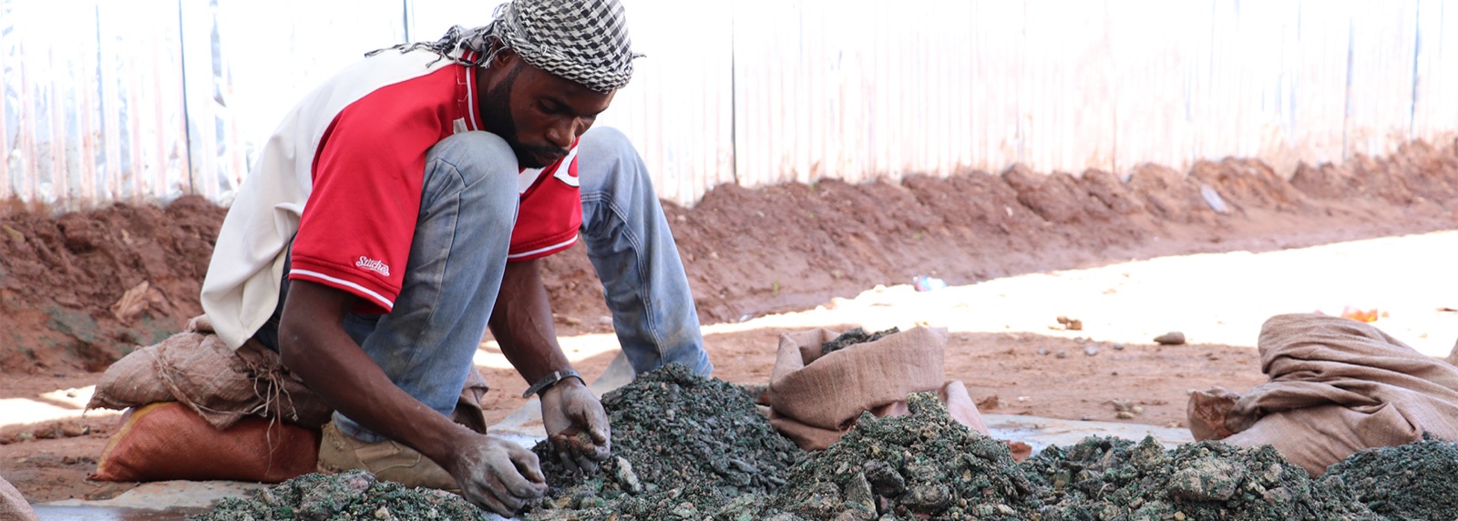 Workers sorting cobalt ore